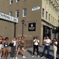 Group of students near restaurant